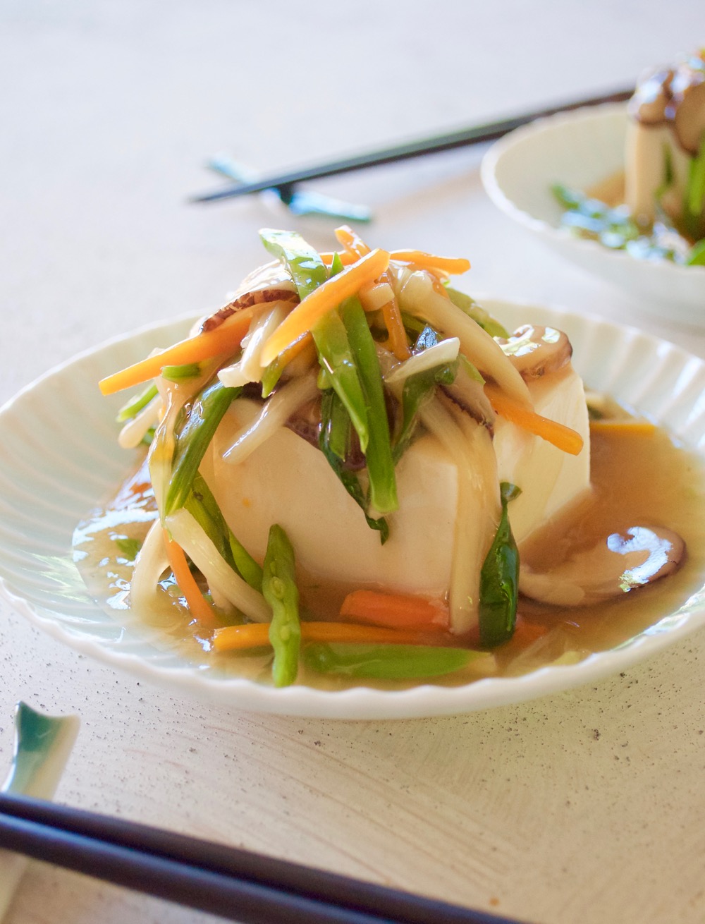 Tofu with plenty of vegetable in thick sauce. It makes the otherwise a simple tofu so special and pretty.