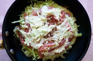 Electric teppanyaki plate and okonomiyaki ingredients.