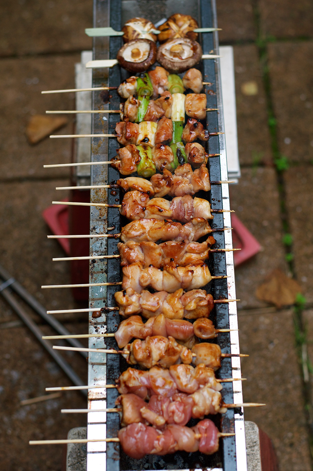 Yakitori is a Japanese skewered chicken, cooked on a griller with either sweet soy sauce or just salt. You don't marinate chicken! Great for entertaining a big crowd as it is a kind of finger food. It is so tasty and easy to eat that you would not realise you ate so many skewers of chicken!
