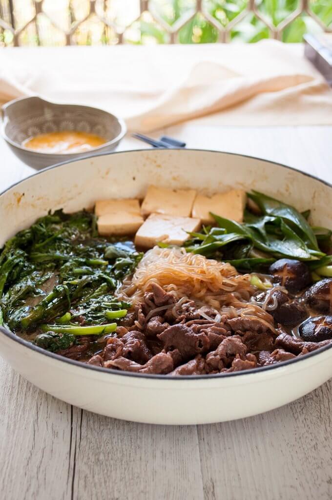 One of the most popular Japanese hot pot dishes, sukiyaki (すき焼き) is great for get-together with friends and family. Cooking thinly sliced beef, tofu and vegetables in sweet soy sauce flavour over a portable cooktop on the table is so much fun. It is quick to prepare and so tasty.