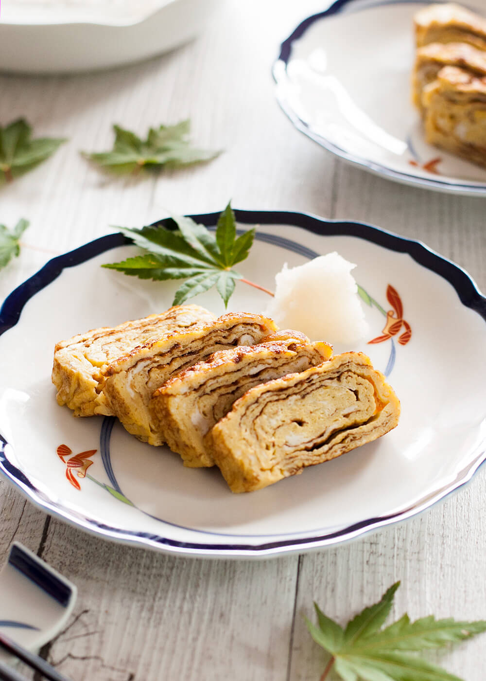 The typical egg dish in Japanese cuisine, dashimaki tamago (出し巻き卵, Japanese rolled omelette) is made by rolling thin layers of egg in the frypan. The beautiful layers of the egg when sliced, and the sweet dashi flavour make this omelette so unique.