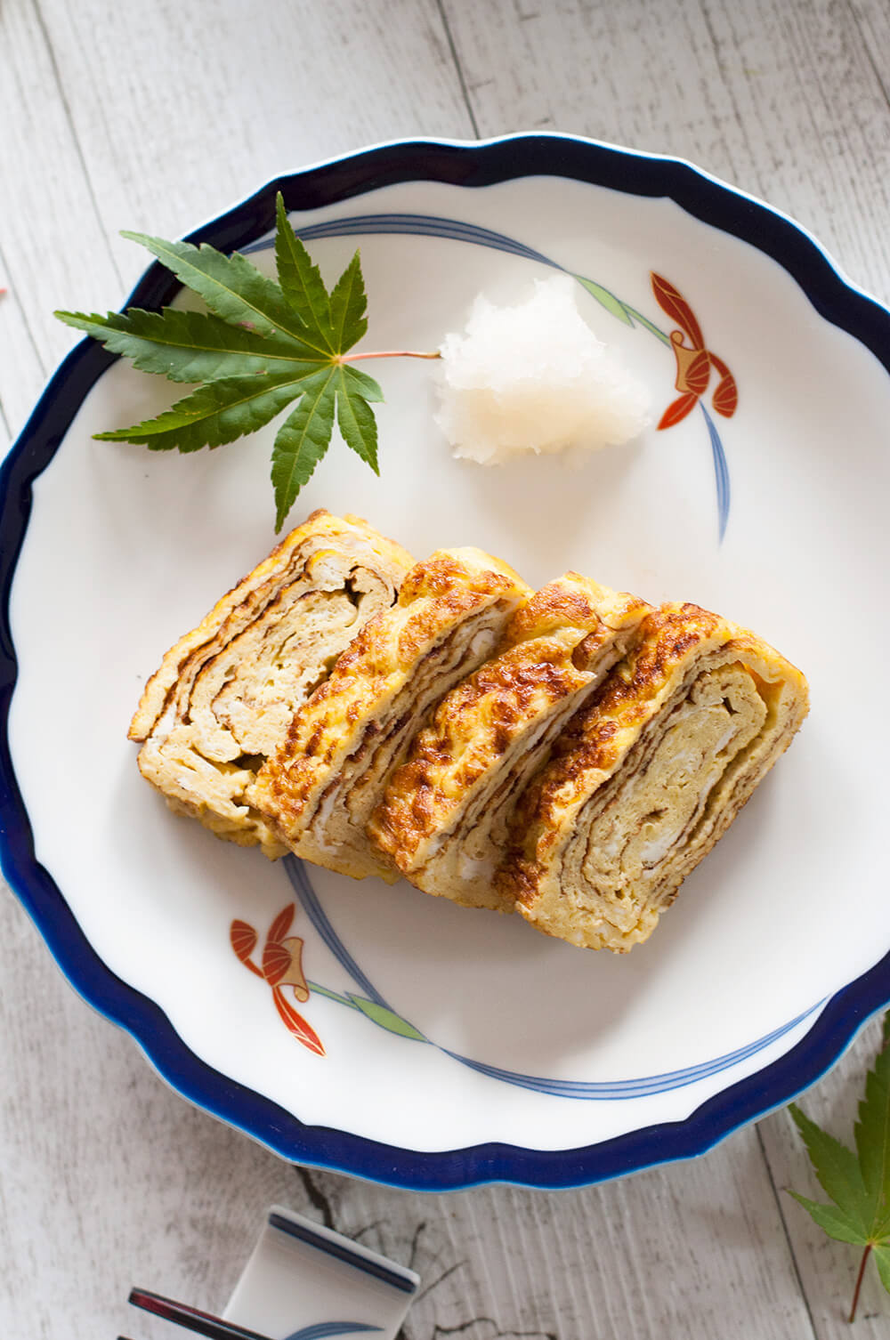 The typical egg dish in Japanese cuisine, dashimaki tamago (出し巻き卵, Japanese rolled omelette) is made by rolling thin layers of egg in the frypan. The beautiful layers of the egg when sliced, and the sweet dashi flavour make this omelette so unique.