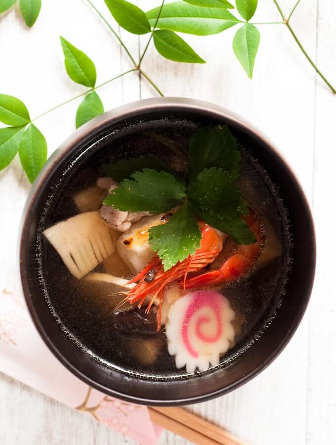 Ozoni is a special dish that most Japanese households serve on New Year’s Day. It is a clear soup with cooked rice cakes and colourful ingredients such as prawns, shiitake, and mitsuba (wild Japanese parsley). Ingredients can vary and you can even make it vegetarian.