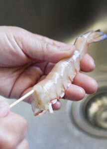 How to skewer prawn to keep it straight when cooked.
