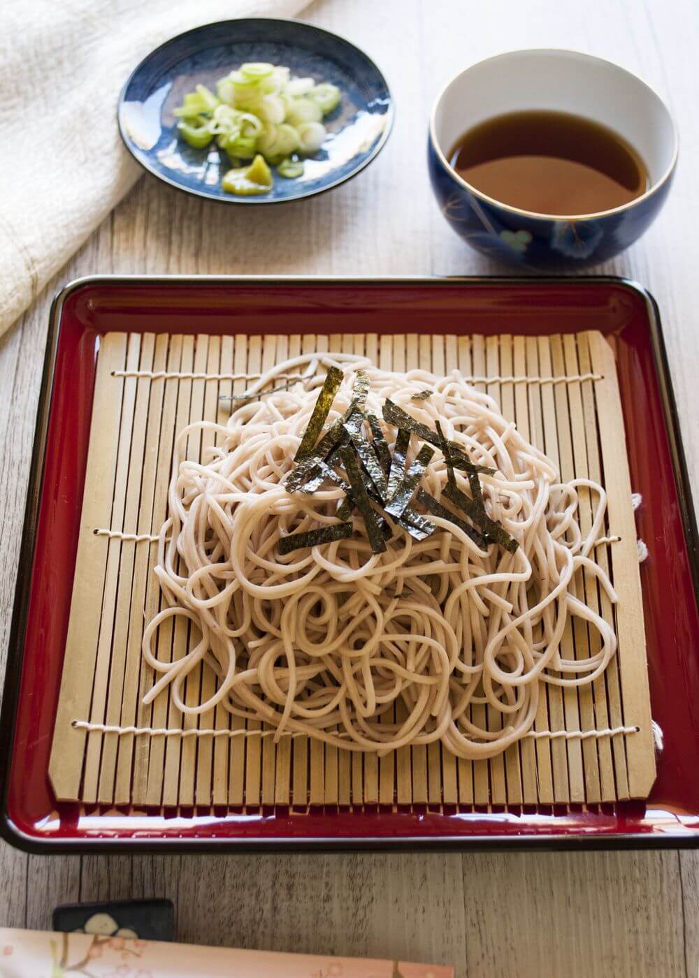 Zaru soba (cold soba noodles) is the best way to eat soba (buckwheat) noodles. Zaru soba is the simplest form of eating noodles and so fast to make. It is a popular summer dish in Japan of course but if you want to be like a connoisseur and enjoy the soba itself, then eat cold even in winter. Use konbu dashi to make it a perfect vegetarian dish.