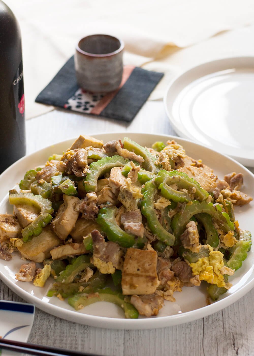 A super easy Japanese stir fry from Okinawa, goya chanpuru is full of bonito flakes, which is unique for a stir fry dish and so flavoursome that you will get addicted to it. It is not greasy at all and my version is made with pork slices instead of SPAM which is the real version of goya chanpuru.