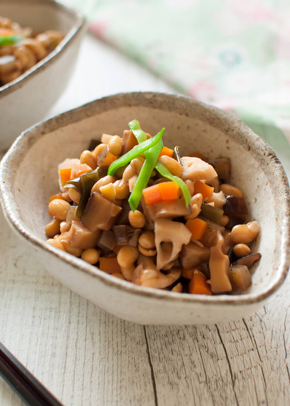 Gomoku-mame (五目豆, Simmered Soybeans with Vegetables) is a wonderful, healthy vegetarian dish. Soybeans are cooked with diced root vegetables in a sweet soy sauce flavour. It keeps well for several days in the fridge and you can freeze it, too.