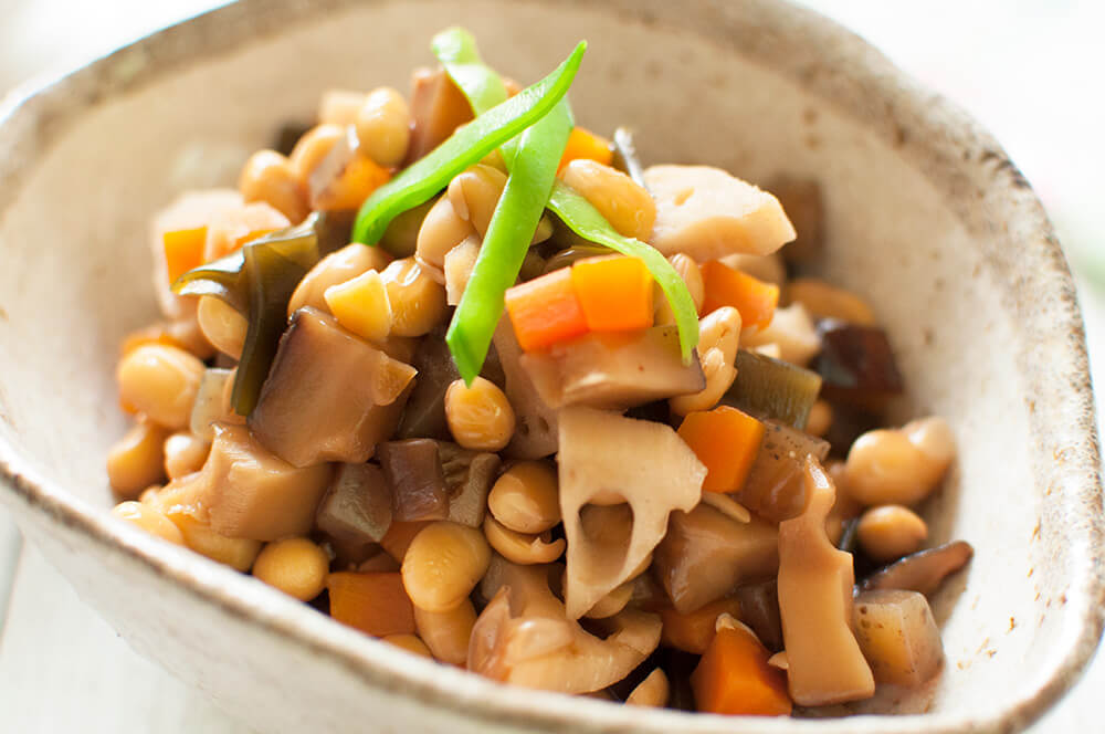 Gomoku-mame (五目豆, Simmered Soybeans with Vegetables) is a wonderful, healthy vegetarian dish. Soybeans are cooked with diced root vegetables in a sweet soy sauce flavour. It keeps well for several days in the fridge and you can freeze it, too.