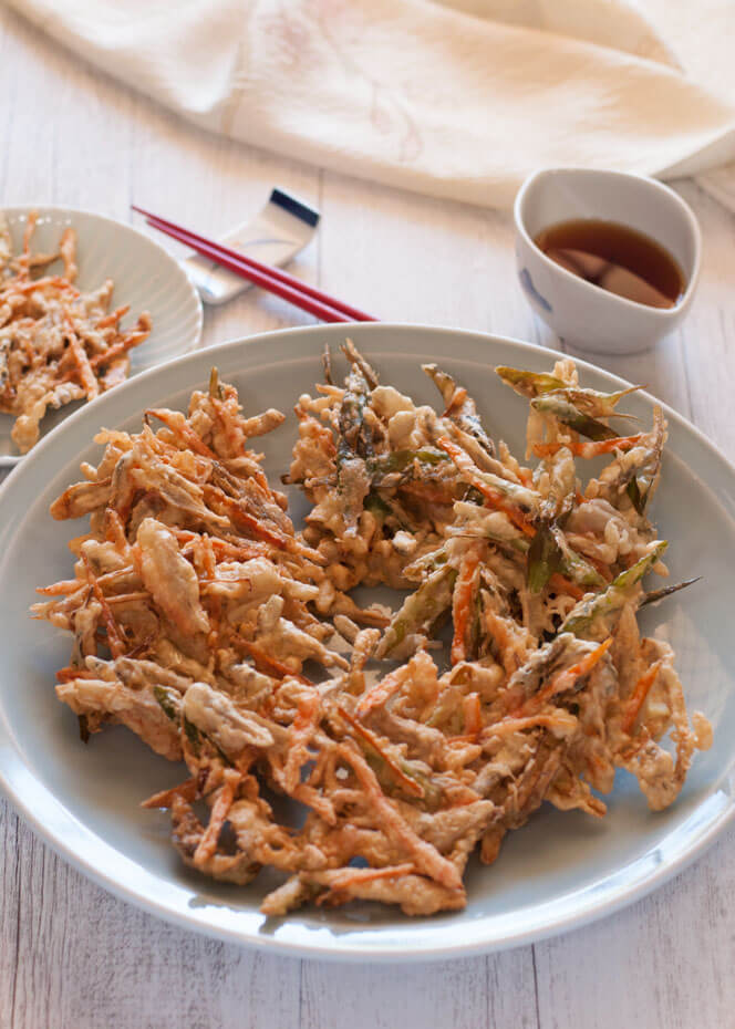 Kakiage is a type of tempura made with a variety of vegetable strips, often with seafood. This is a popular home cooking dish as it uses leftover vegetables to clean up the fridge for the week. 
