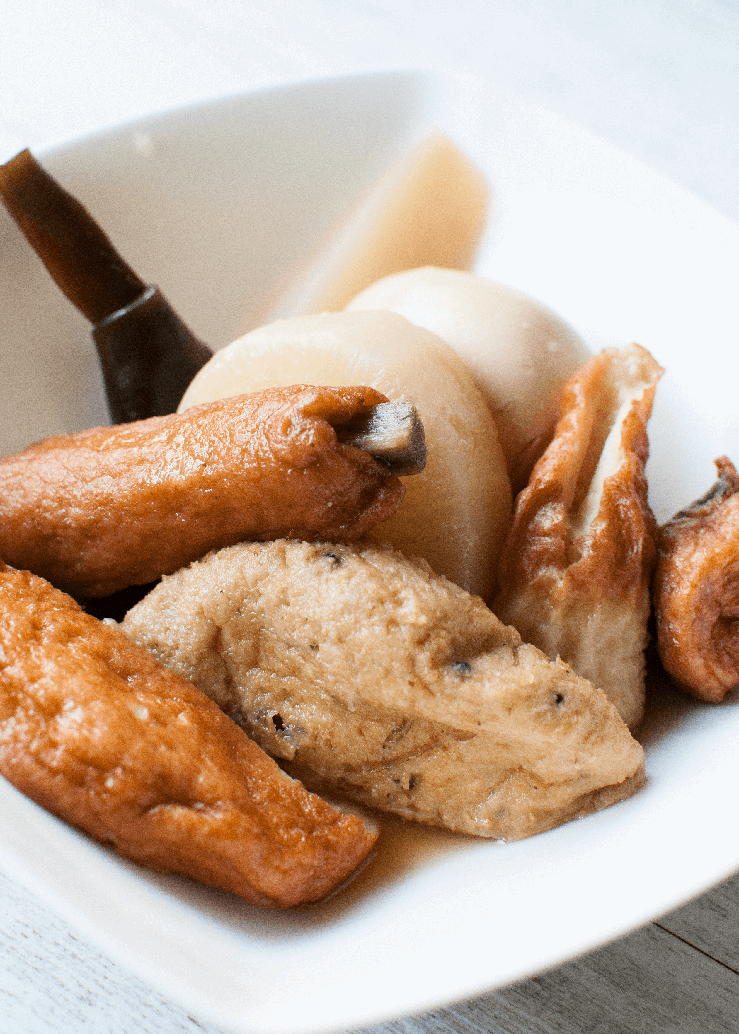 Oden is a kind of hot pot consisting of daikon, potatoes, eggs, Konbu (kelp), konnyaku, and different types of fish cakes, simmered in lightly flavoured soup stock. 
