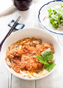 Katsu-don (カツ丼), is a very filling main dish. A bowl of rice topped with tonkatsu (deep fried crumbed pork cutlet), onion and beaten egg, cooked in dashi with sweet soy sauce.