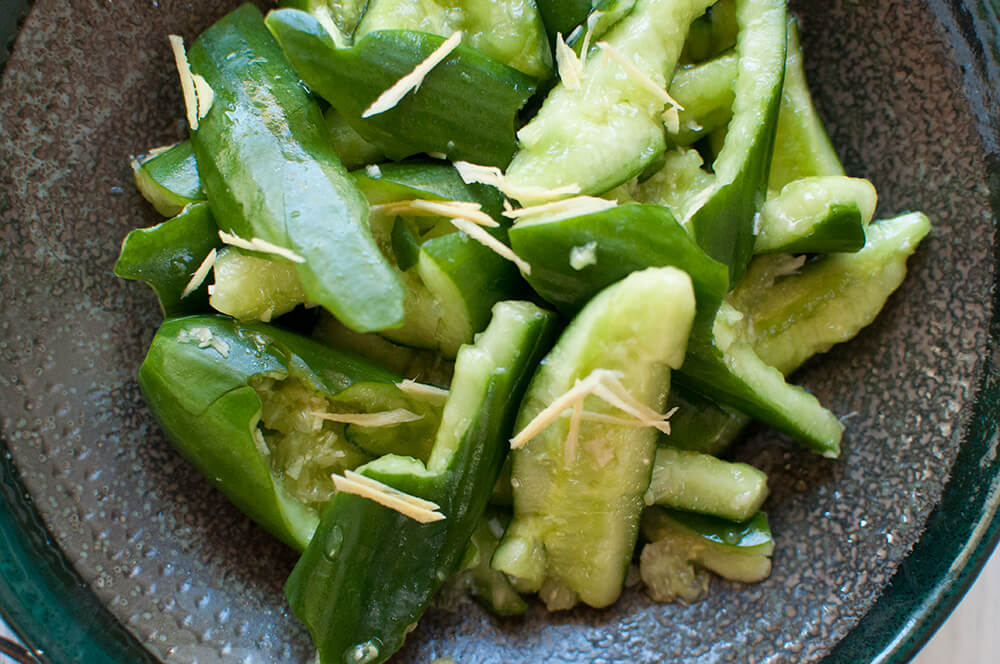 Tataki kyuri is a simple but unique cucumber salad. By smashing the cucumbers, the dressing penetrates into each piece. Ginger and soy sauce in the dressing gives this salad a Japanese touch.