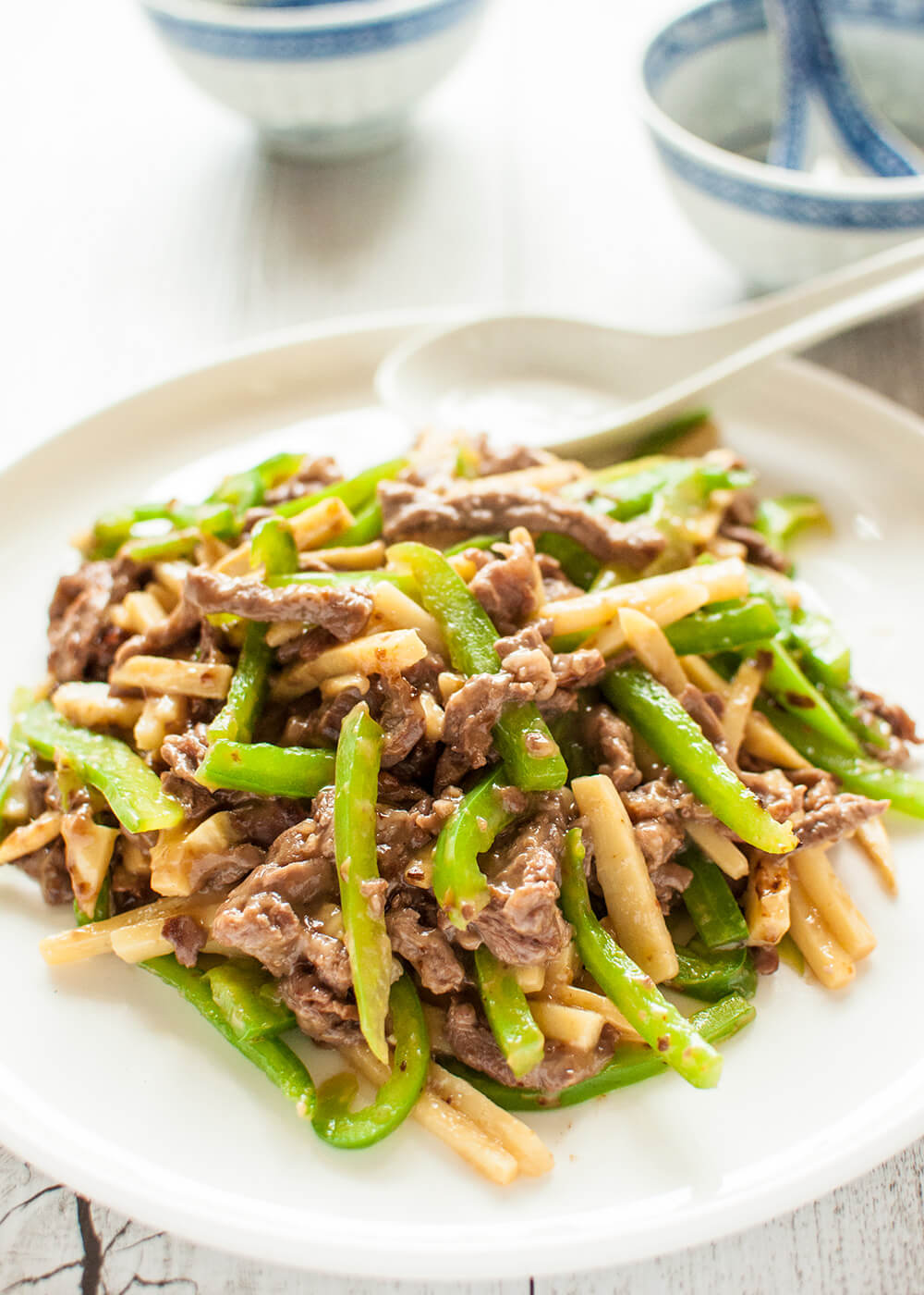 This is a quick stir fry dish that originated in China. Beef, green pepper (capsicum) and bamboo shoots are cut into thin strips and cooked in soy flavoured sauce with a touch of oyster sauce.