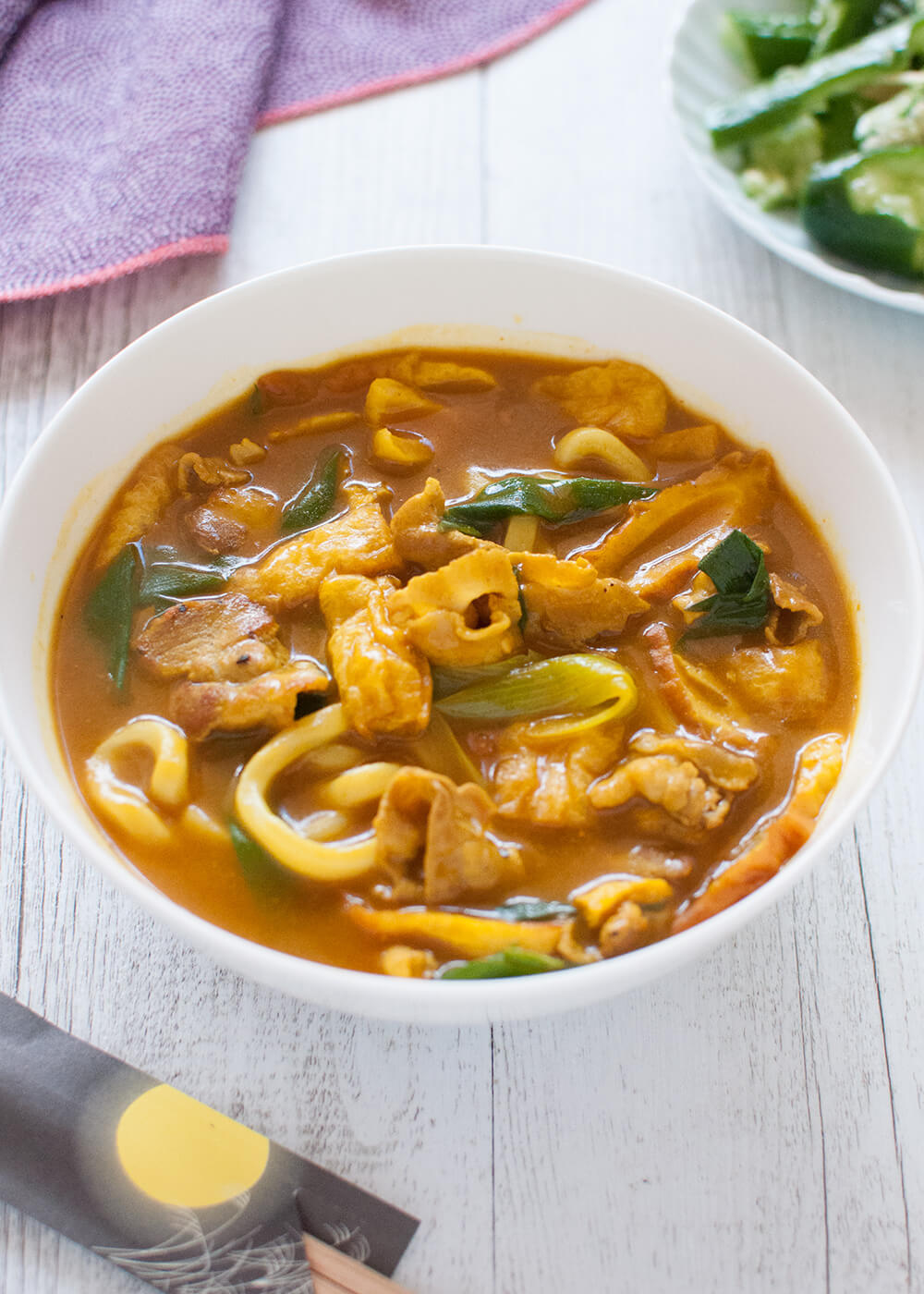 This is not just a simple bowl of udon noodles but curry flavoured noodles with pork, shallots (scallions), aburaage (deep fried tofu) and fish cakes. I made the curry sauce from scratch and flavour is amazing – almost noodle restaurant quality.