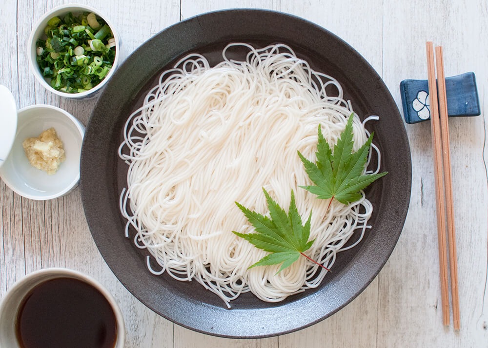 Somen (or sōmen) is a very thin noodles served cold which makes it a perfect summer dish. Noodles are served in chilled water and the dipping sauce is also chilled.