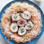 Steamed Rolled Chicken surrounded by julienned vegetable salad, photo taken from top.
