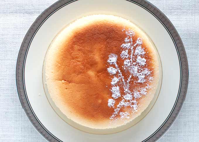 Japanese Cheesecake decorated with icing sugar.