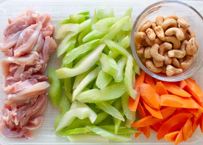 Ingredients of Chicken Stir Fry with Celery, Carrot and Cashew.