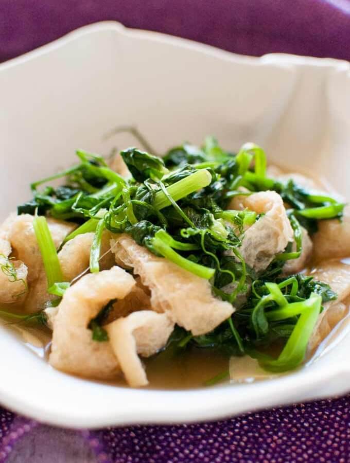 Snow Pea Leaves Warm Salad in a bowl..