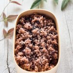 Hero shot of Azuki Bean Rice (Osekihan) in a wooden container.