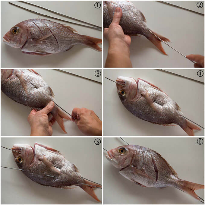 Step-by-step phots of skewering a whole snapper.