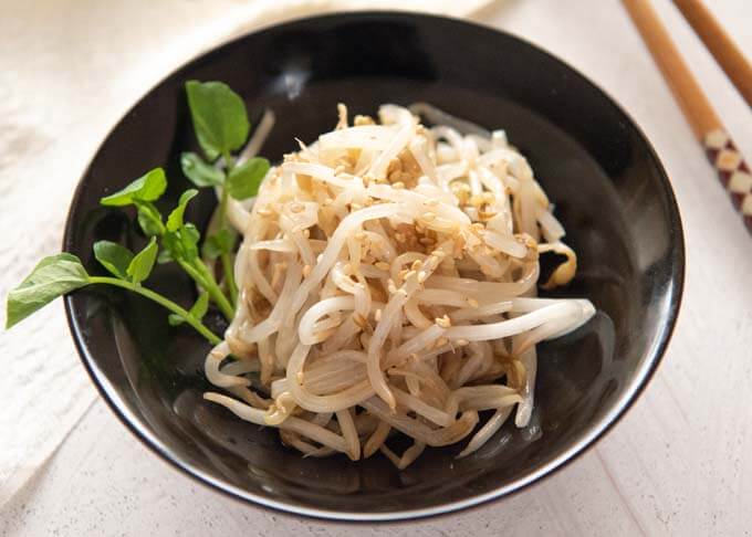 Landscape view of Sesame Bean Sprouts served in a bowl.