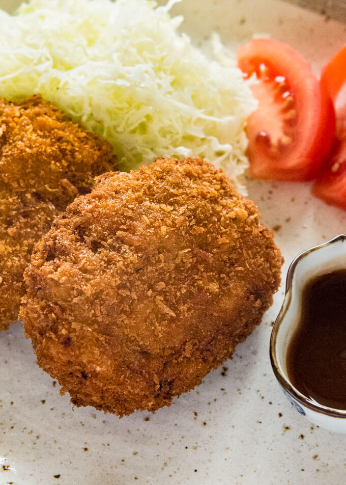 Hero shot of Menchi Katsu served on a plate.