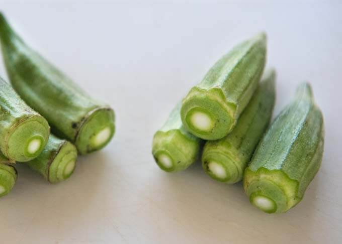Trimmed okra - before and after.