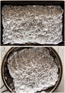 A tray and a Frying pan with scrunched aluminium foil.