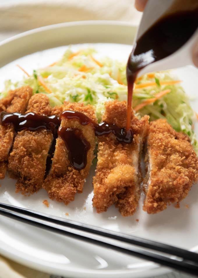Japanese chicken Cutlet , sauce pouring over it.
