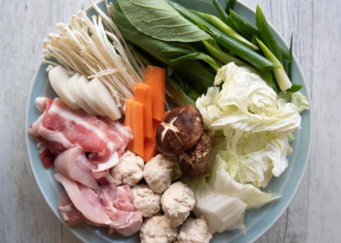 Ingredients of Chanko Nabe displayed on a plate.