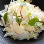 Hero shot of Chinese Cabbage and Apple Salad on a serving bowl.