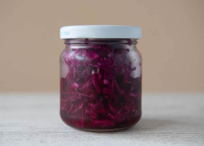 Pickled Red Cabbage stored in a glass jar.