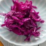 Sweet and Sour Pickled Red Cabbage in a small serving plate..