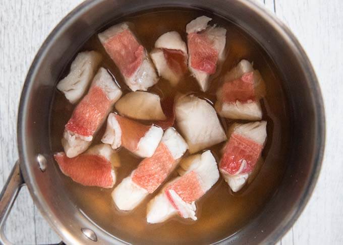 Fish cooked in the broth.