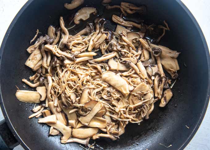 Sautéed mushrooms in a frying pan.