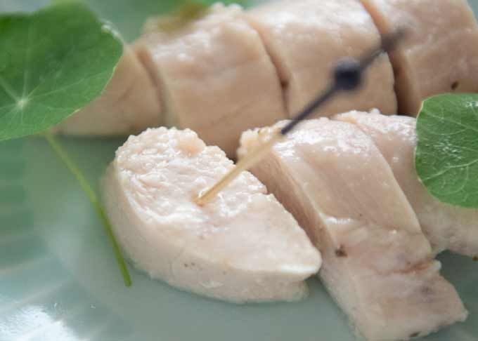 Zoomed-in photo of Marinated Chicken Tenderloin on a plate.