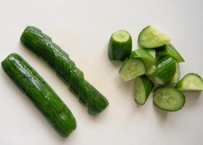 Two different ways of cutting Salt Pickled Cucumbers.