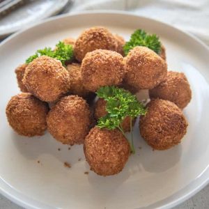 Hero shot of Pumpkin Croquettes piled on a plate.