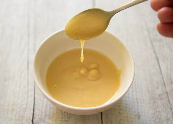 Showing the thikness of the Mustard-miso Dressing.