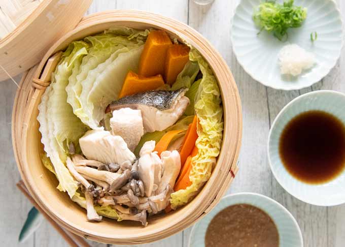 Top-down photo of Steamed Chicken and Fish with Vegetables.