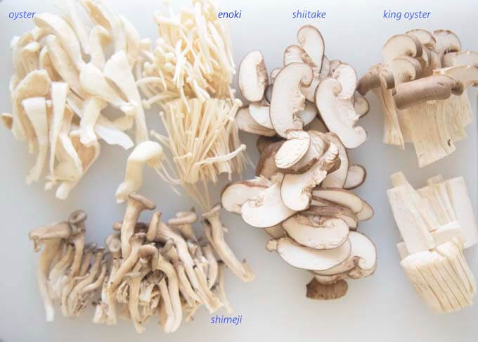 5 kinds of Asian mushrooms, sliced to similar sizes.