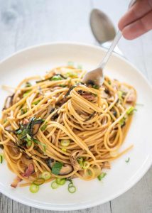 Taking some pasta with a fork.