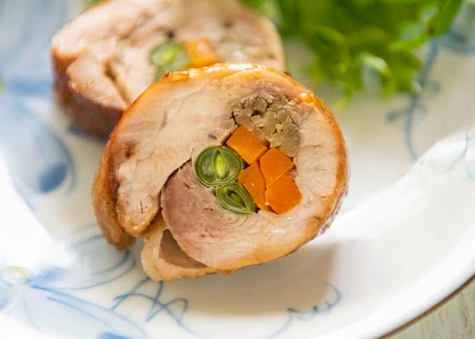 Zoomed-in photo of a piece of Rolled Chicken Stuffed with Vegetables.