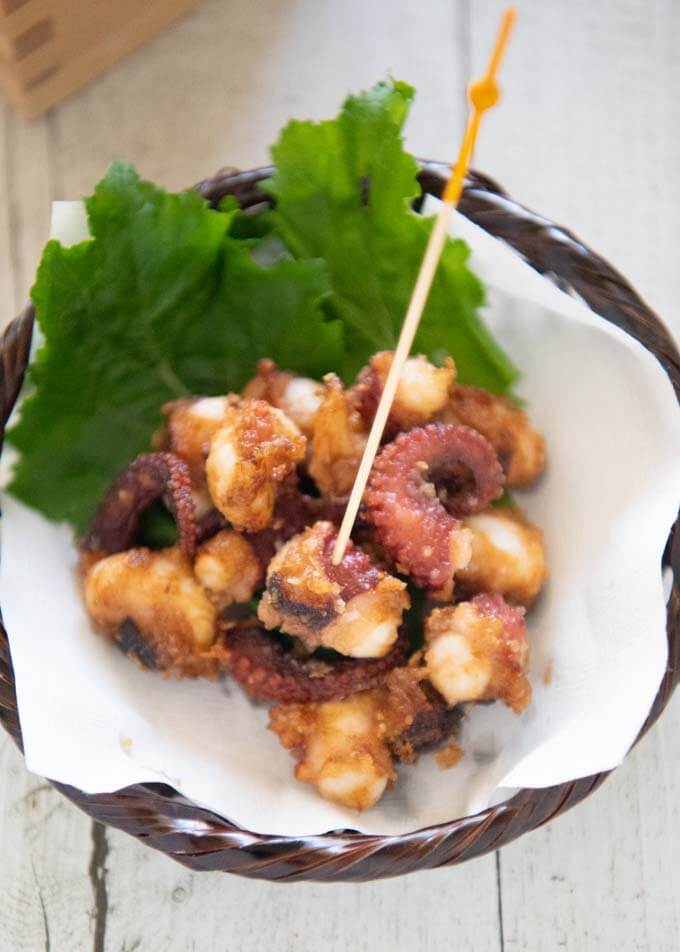 A piece of Deep-fried Marinated Octopus (Octopus Karaage) poked with a tooth pick.