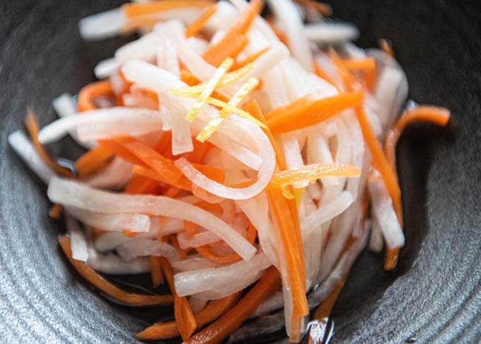 Zoomed-in photo of Pickled Carrot and Daikon (Kōhaku Namasu).