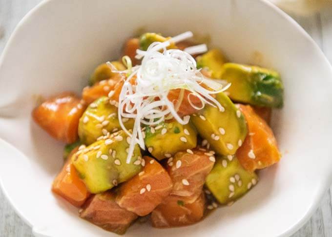 Zoomed-in photo of Salmon and Avocado in Wasabi Soy Dressing.