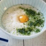 Hero shot of Quail Egg on Grated Mountain Yam served in a bowl.