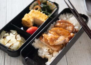 Half eaten Teriyaki Chicken Bento.