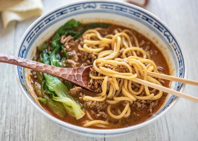 Noodles mixed with niku miso topping in the bowl of Tantanmen..